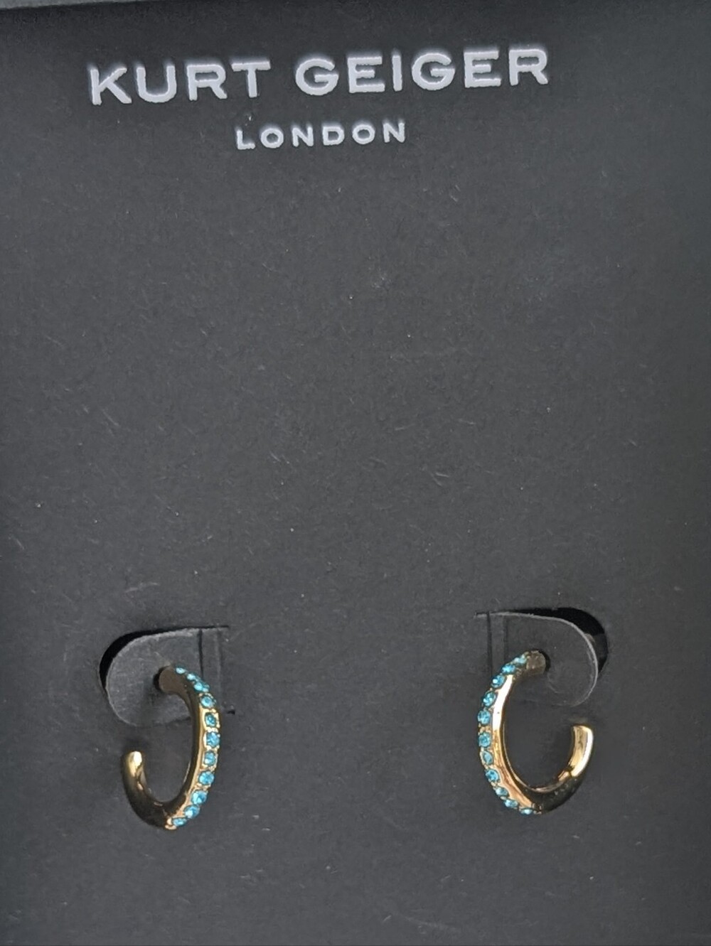 Kurt Geiger Small Pavé Huggie Hoop Earrings In Gold Tone With Blue Crystals